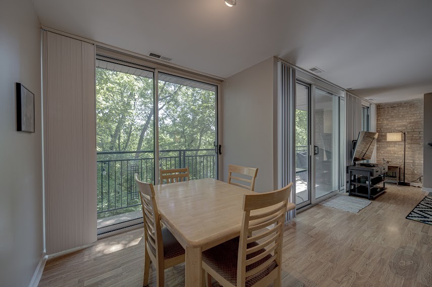 5904 Forest View Road, Unit 2F Lisle, IL 60532 - Photo 10 of 28 a view of a dining room with furniture and a window