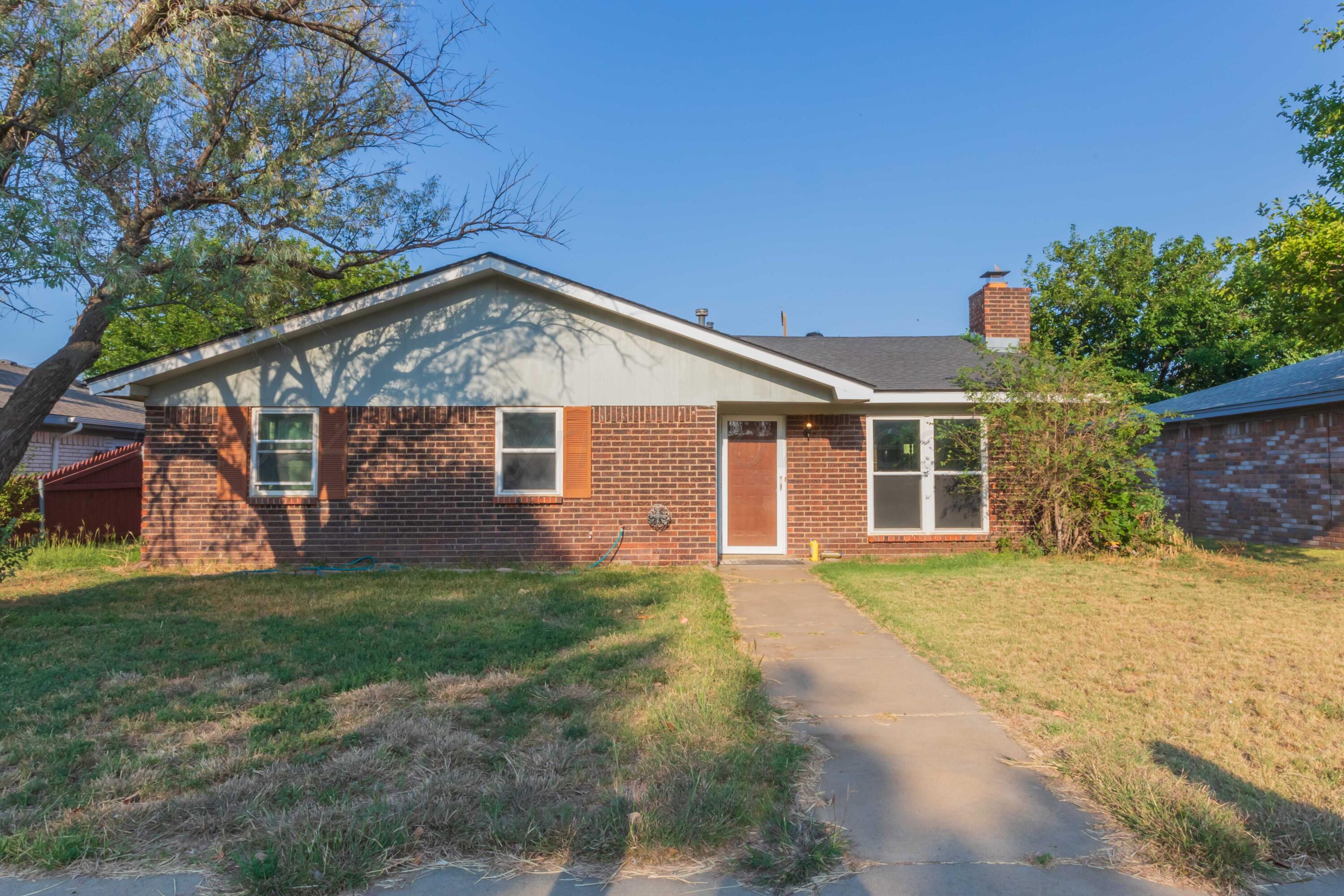 5304 Leigh Avenue Amarillo, TX 79110 - Photo 1 of 36 a front view of a house with a garden