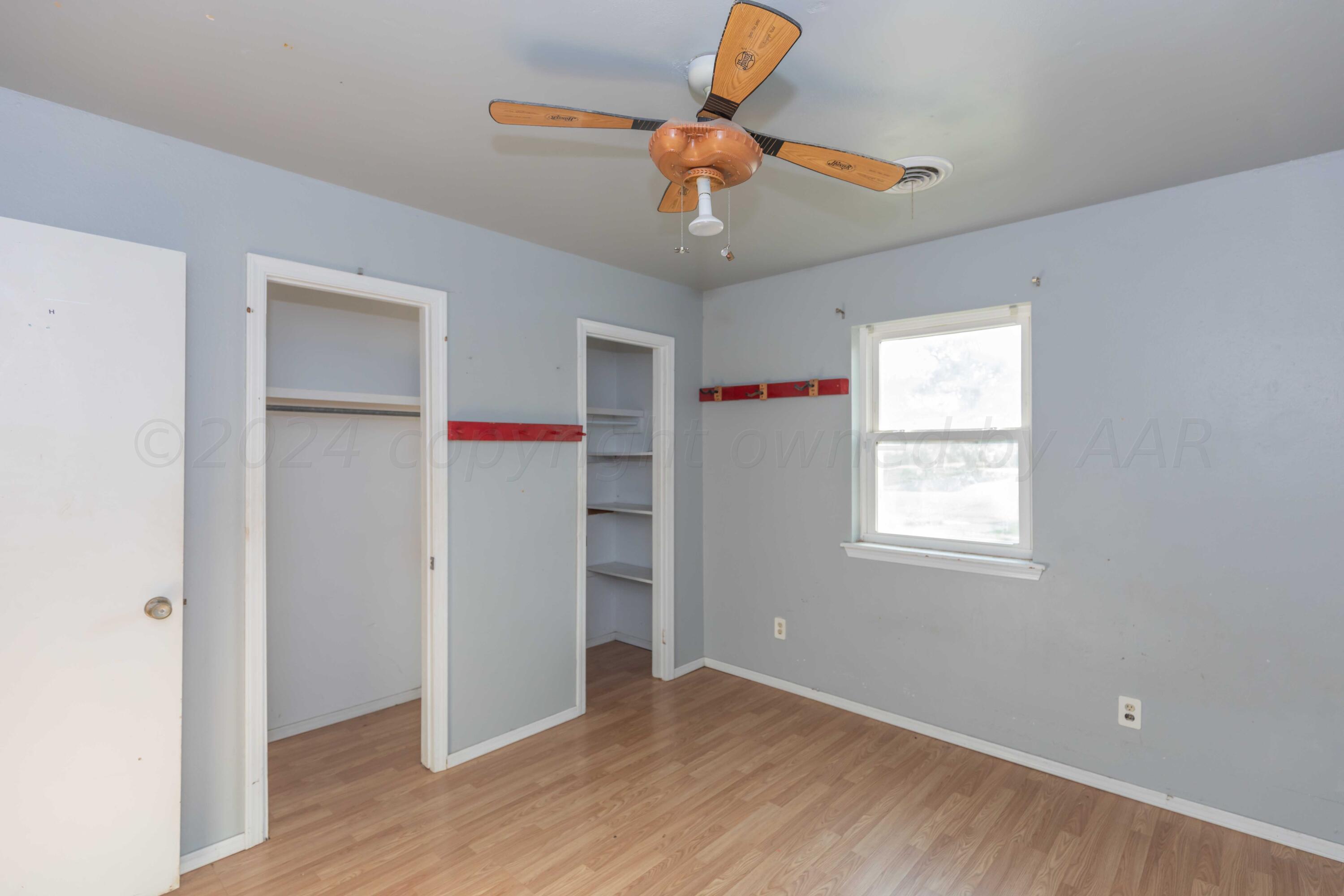 5304 Leigh Avenue Amarillo, TX 79110 - Photo 11 of 36 a view of an empty room with a window