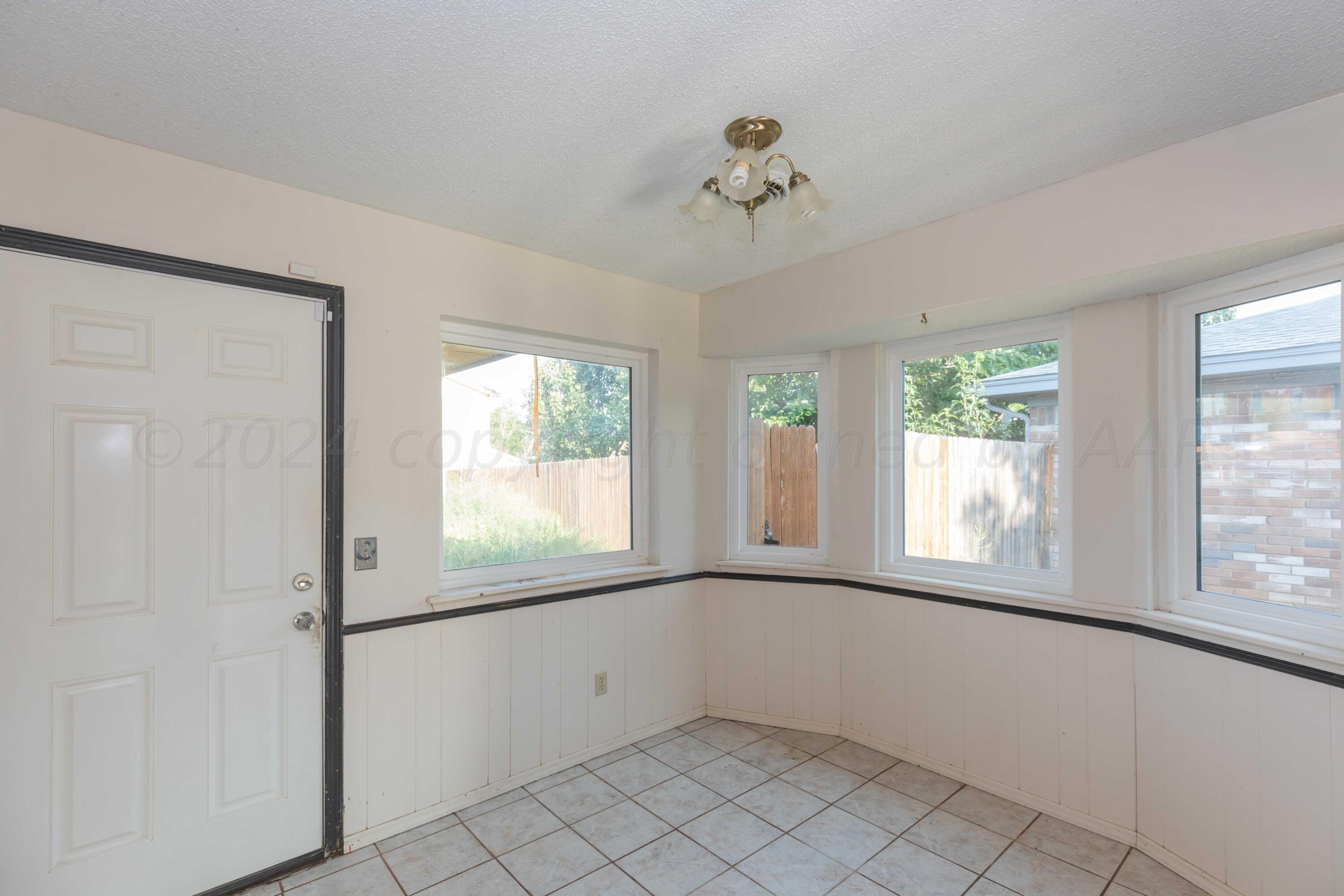 5304 Leigh Avenue Amarillo, TX 79110 - Photo 14 of 36 a view of an empty room with a window