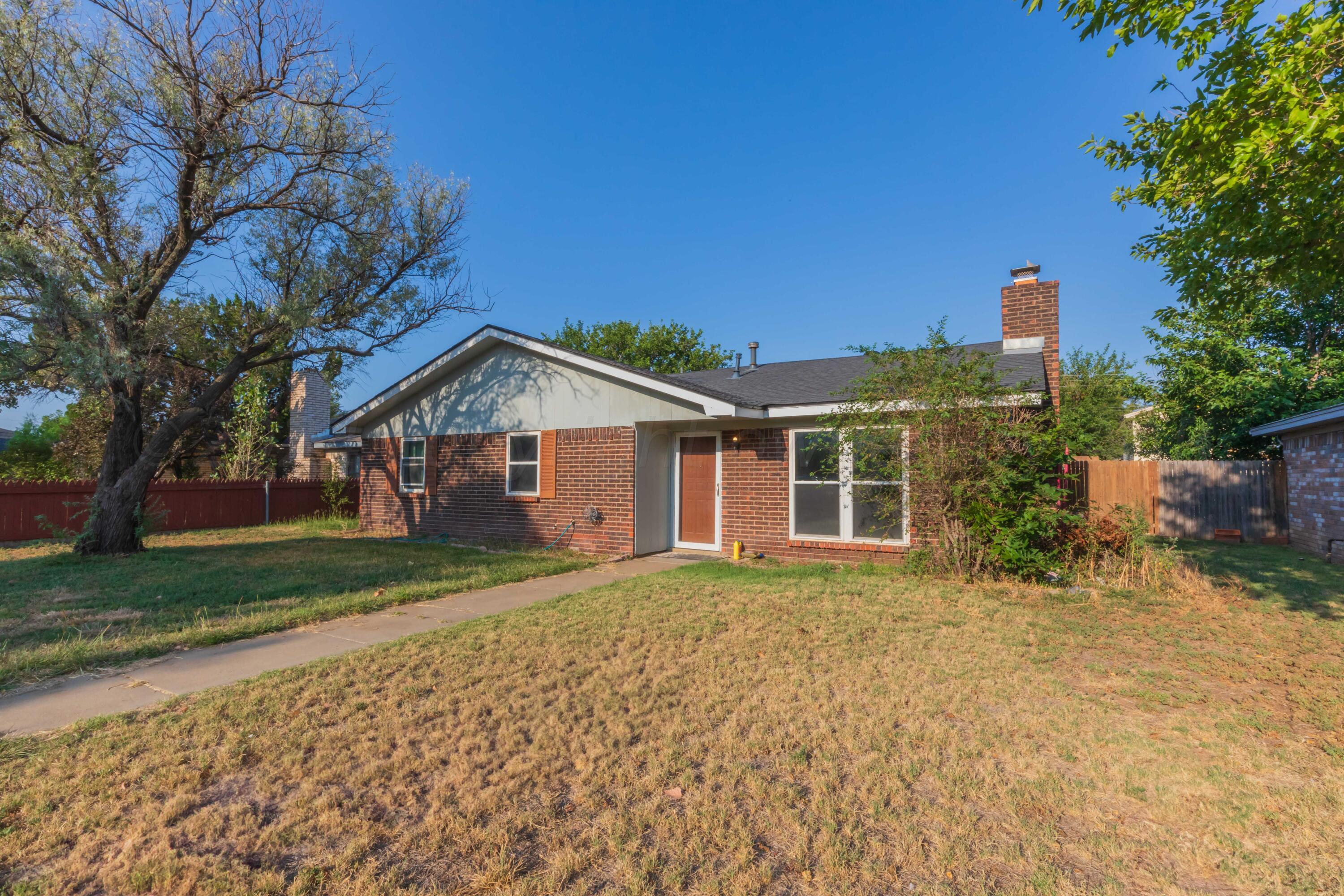 5304 Leigh Avenue Amarillo, TX 79110 - Photo 17 of 36 a front view of a house with a yard