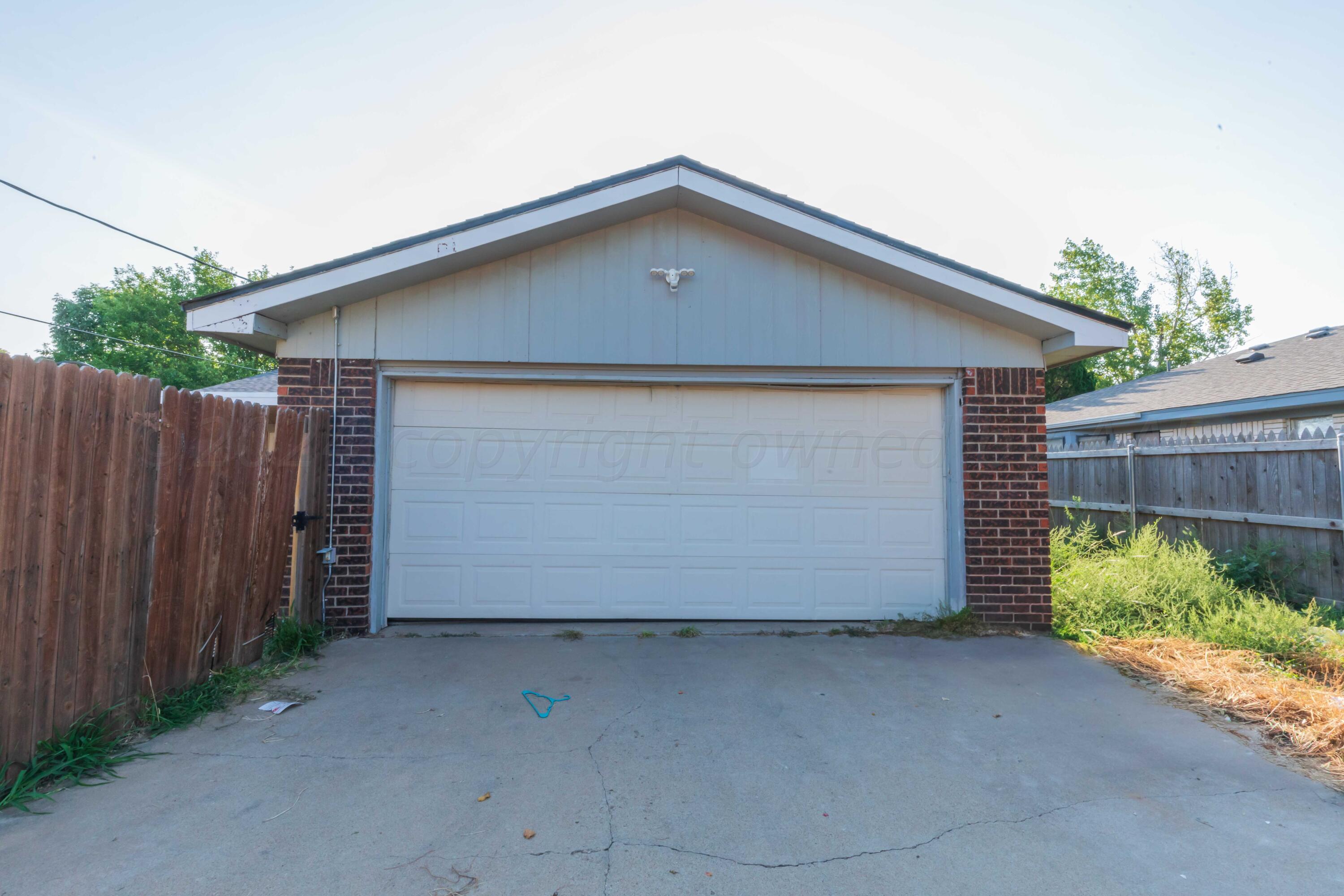 5304 Leigh Avenue Amarillo, TX 79110 - Photo 19 of 36 a front view of a house with a garage