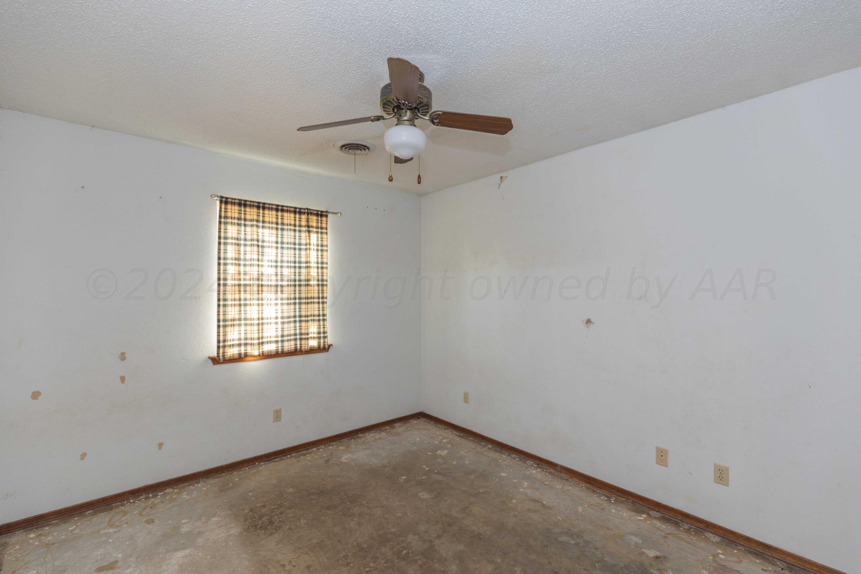 5304 Leigh Avenue Amarillo, TX 79110 - Photo 6 of 36 an empty room with a window