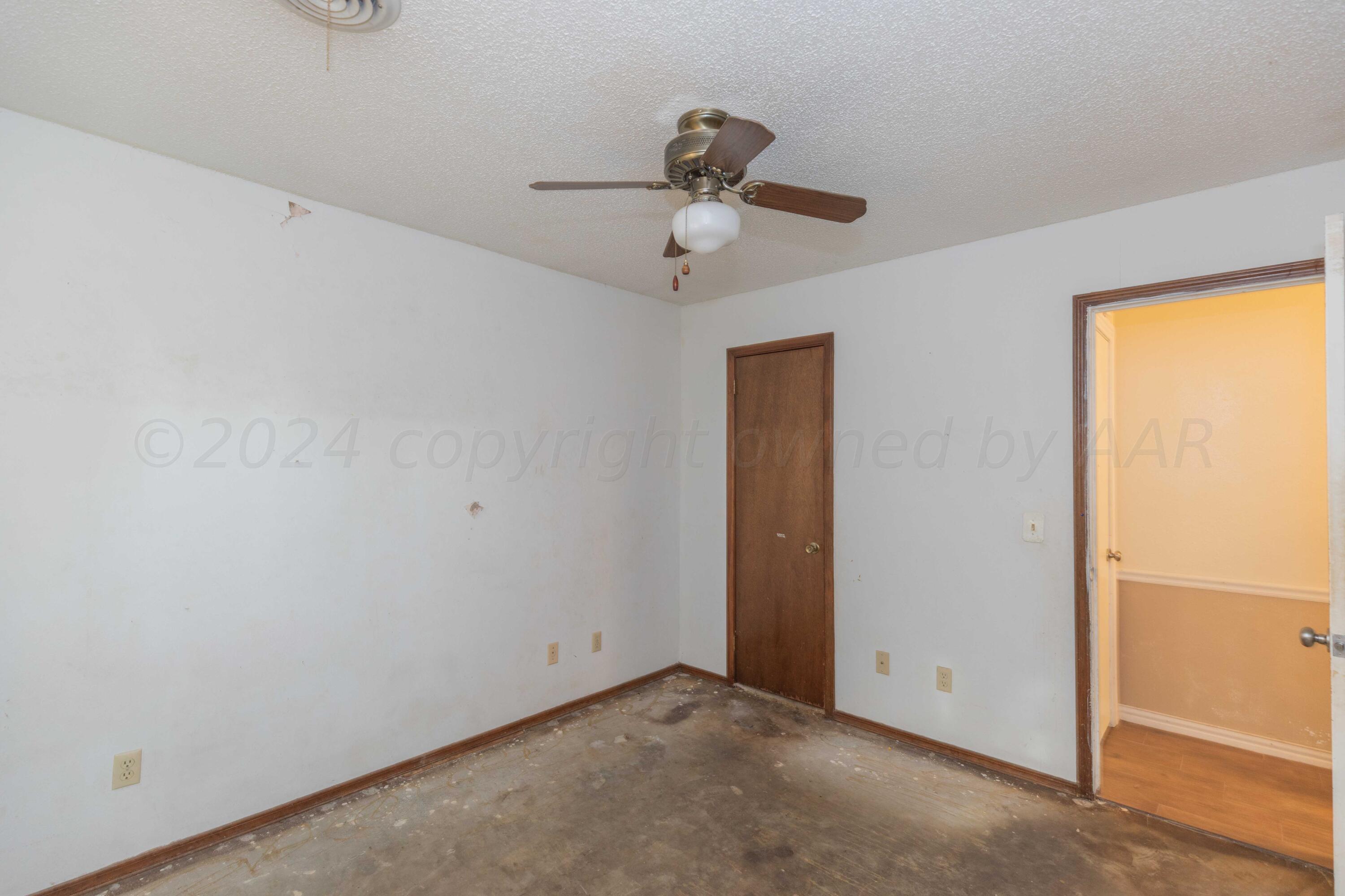 5304 Leigh Avenue Amarillo, TX 79110 - Photo 7 of 36 a view of room with window and ceiling fan