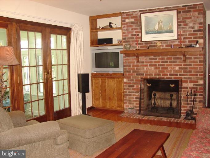 13809 Manor Glen Road Baldwin, MD 21013 - Photo 8 of 13 a living room with furniture and a fireplace