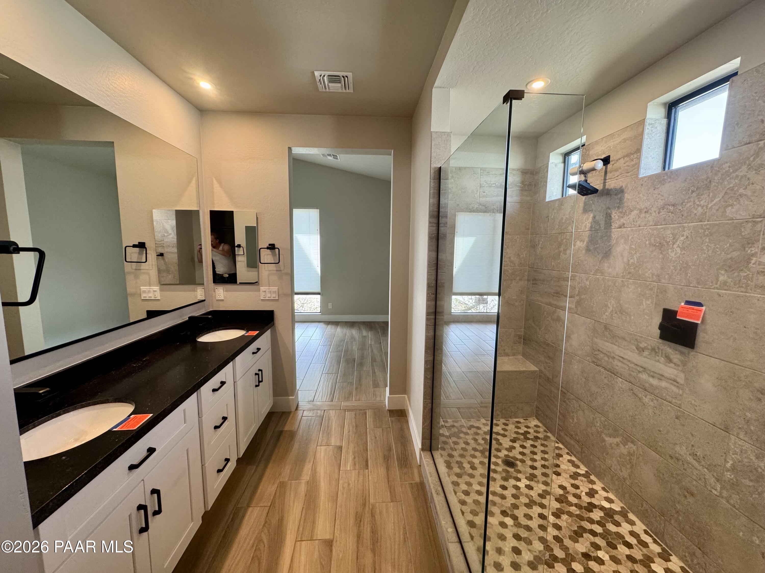 5556 East Killen Loop Prescott Valley, AZ 86314 - Photo 12 of 27 a spacious bathroom with double vanity and a shower