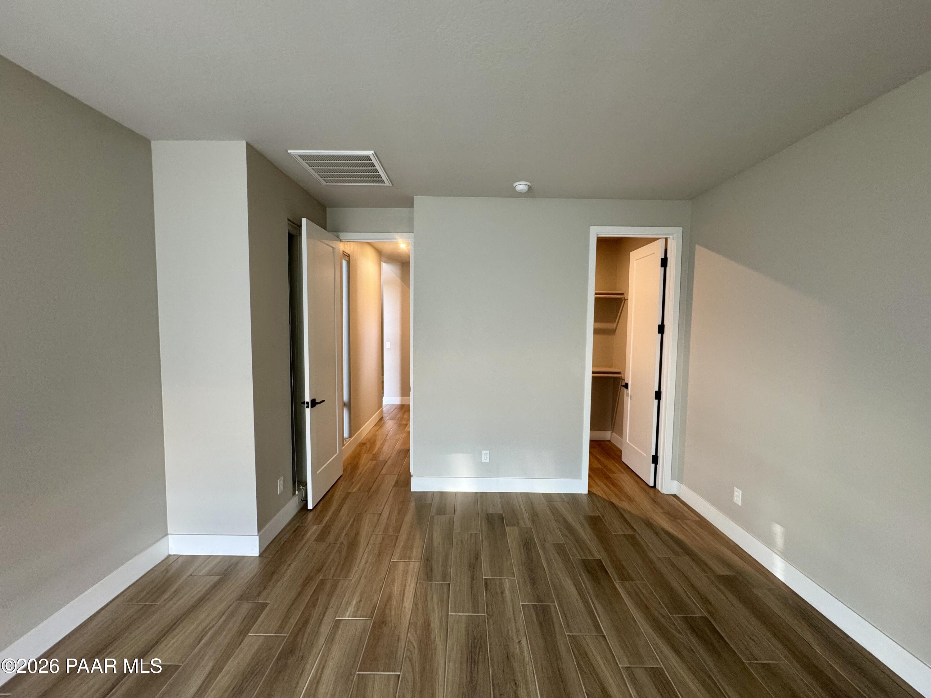 5556 East Killen Loop Prescott Valley, AZ 86314 - Photo 15 of 27 a view of a room with wooden floor and a window