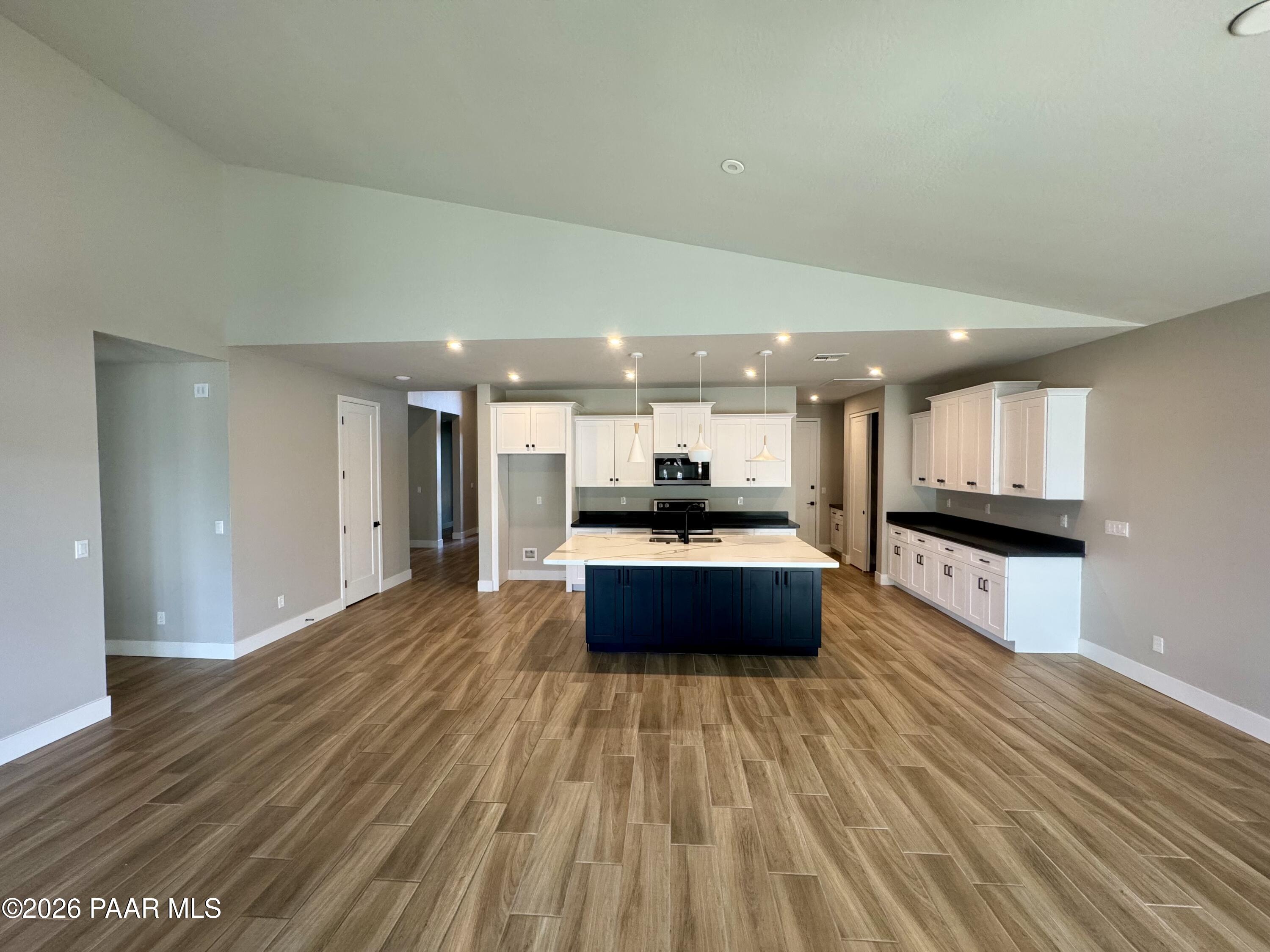 5556 East Killen Loop Prescott Valley, AZ 86314 - Photo 4 of 27 a large room with a couch and wooden floor