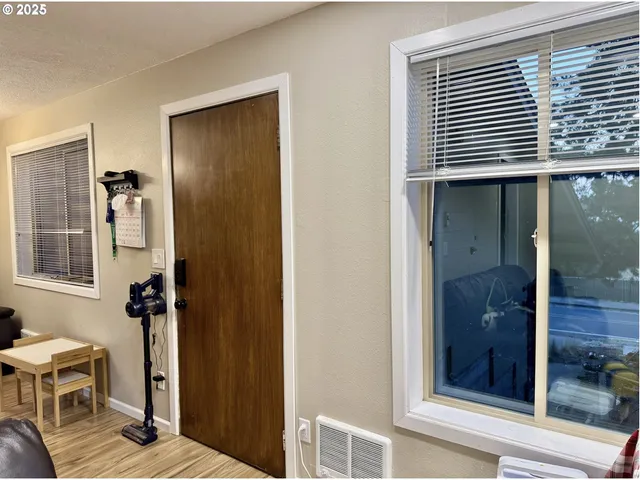 a bathroom with a shower and a sink