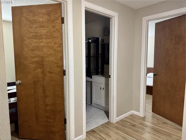 a view of a bathroom from a hallway