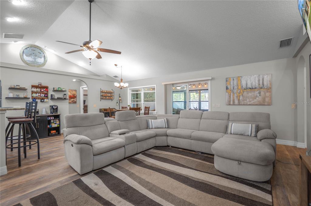 5466 West Tortuga Loop Lecanto, FL 34461 - Photo 8 of 41 a living room with furniture a ceiling fan and a window