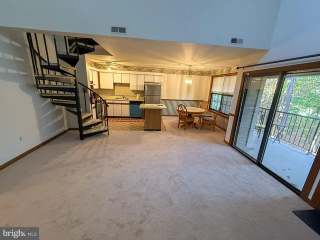 a view of livingroom with furniture and windows