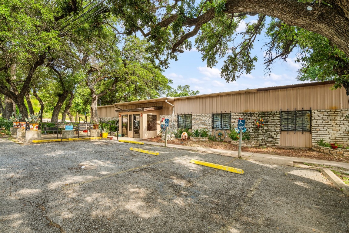 13436 State Highway 71 Bee Cave, TX 78738 - Photo 11 of 35 front view of a house with a big yard