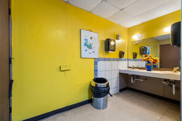 a room with a bed and cabinets