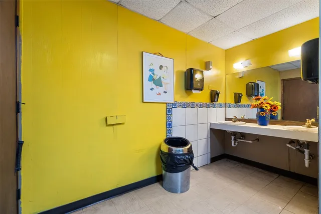 a room with a bed and cabinets