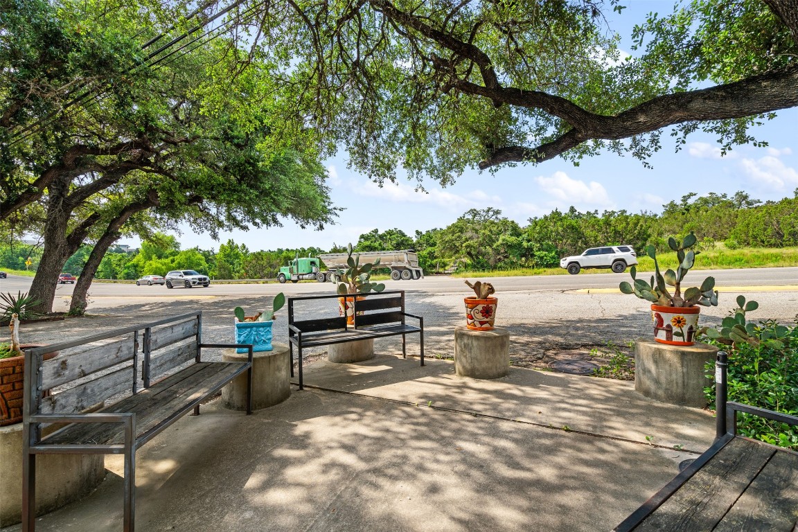 13436 State Highway 71 Bee Cave, TX 78738 - Photo 2 of 35 an outdoor sitting area with a tree
