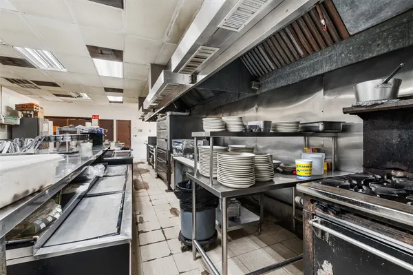 a kitchen with a stove and a table