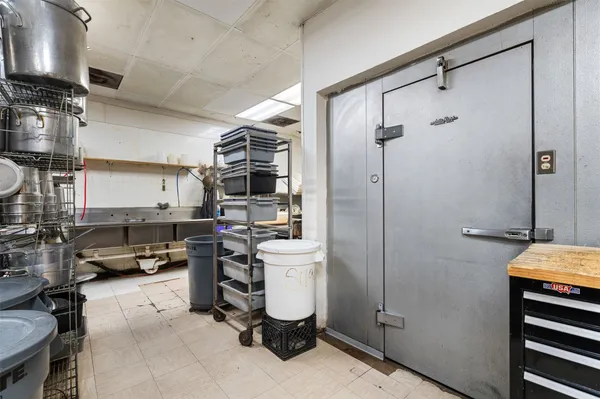 a kitchen with stainless steel appliances a refrigerator and cabinets