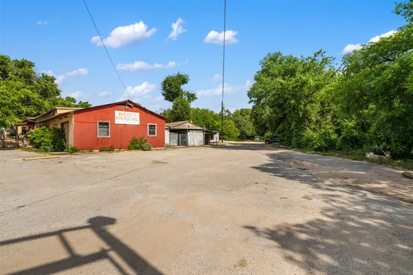 a front view of a house with a yard and a garage
