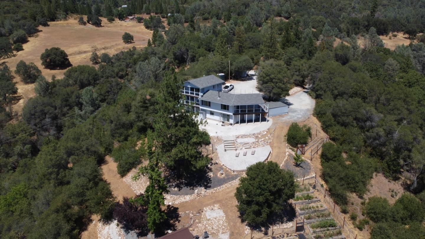 2235 Skunk Ranch Road Murphys, CA 95247 - Photo 1 of 22 an aerial view of a house with yard and parking