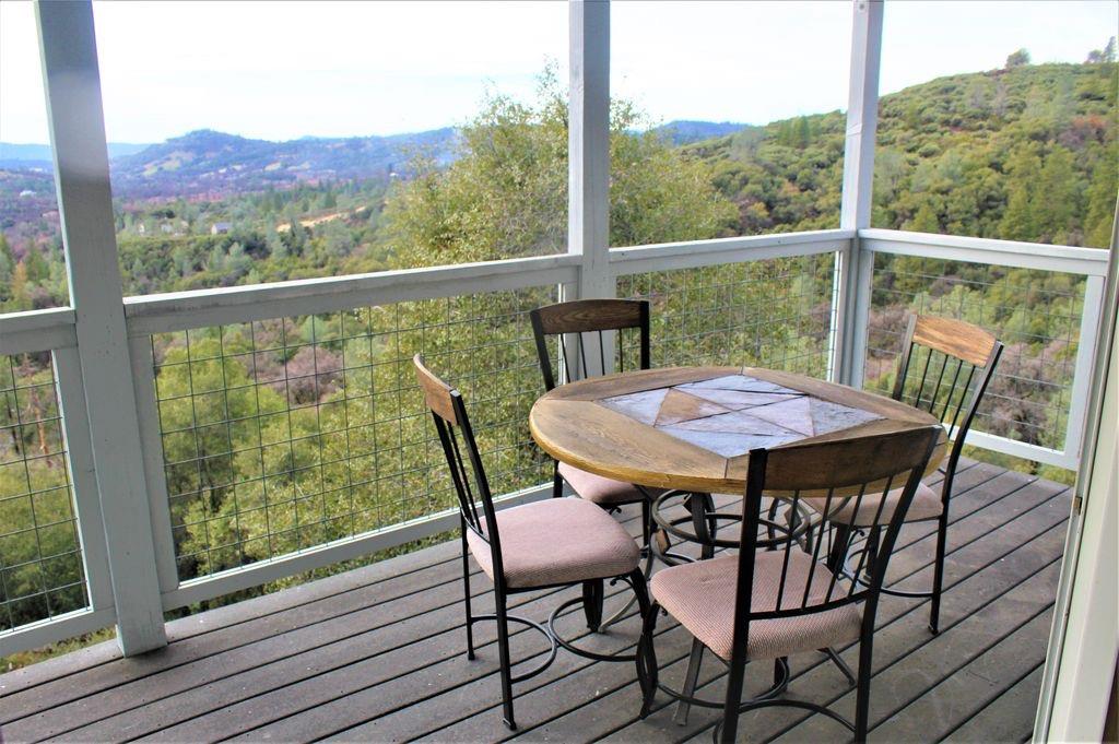 2235 Skunk Ranch Road Murphys, CA 95247 - Photo 14 of 22 a view of a chairs and table in the balcony