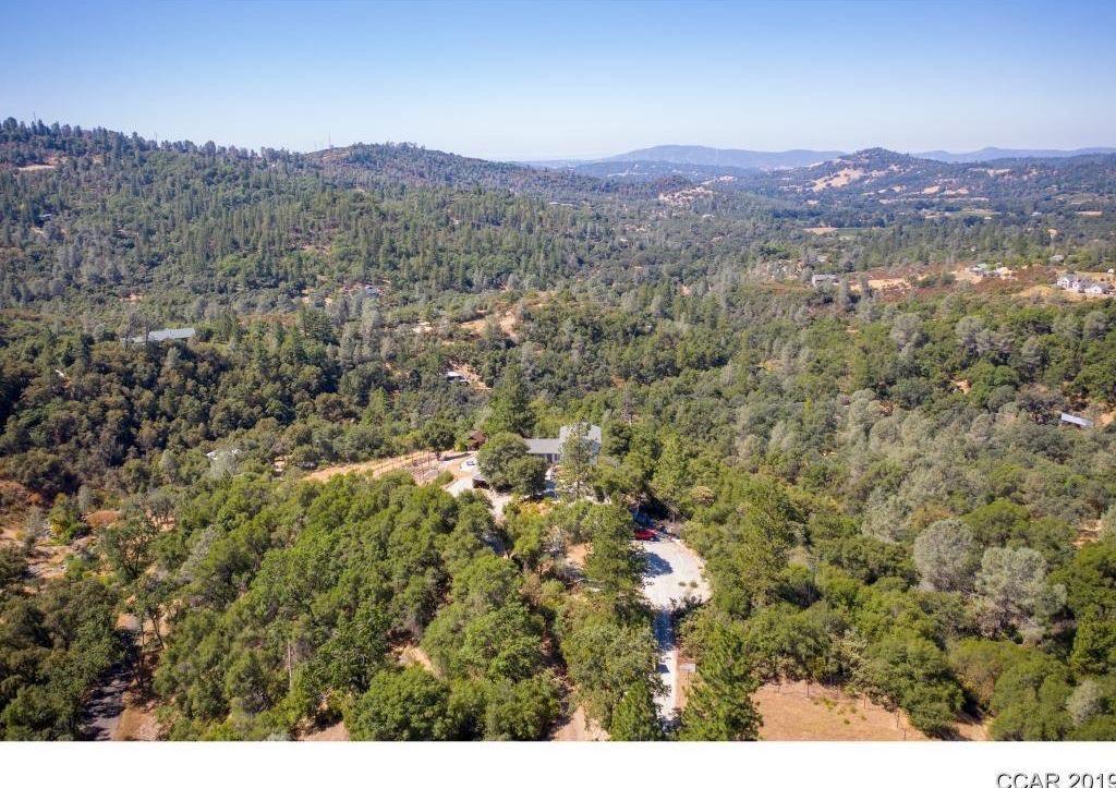 2235 Skunk Ranch Road Murphys, CA 95247 - Photo 18 of 22 a view of a city with lush green forest