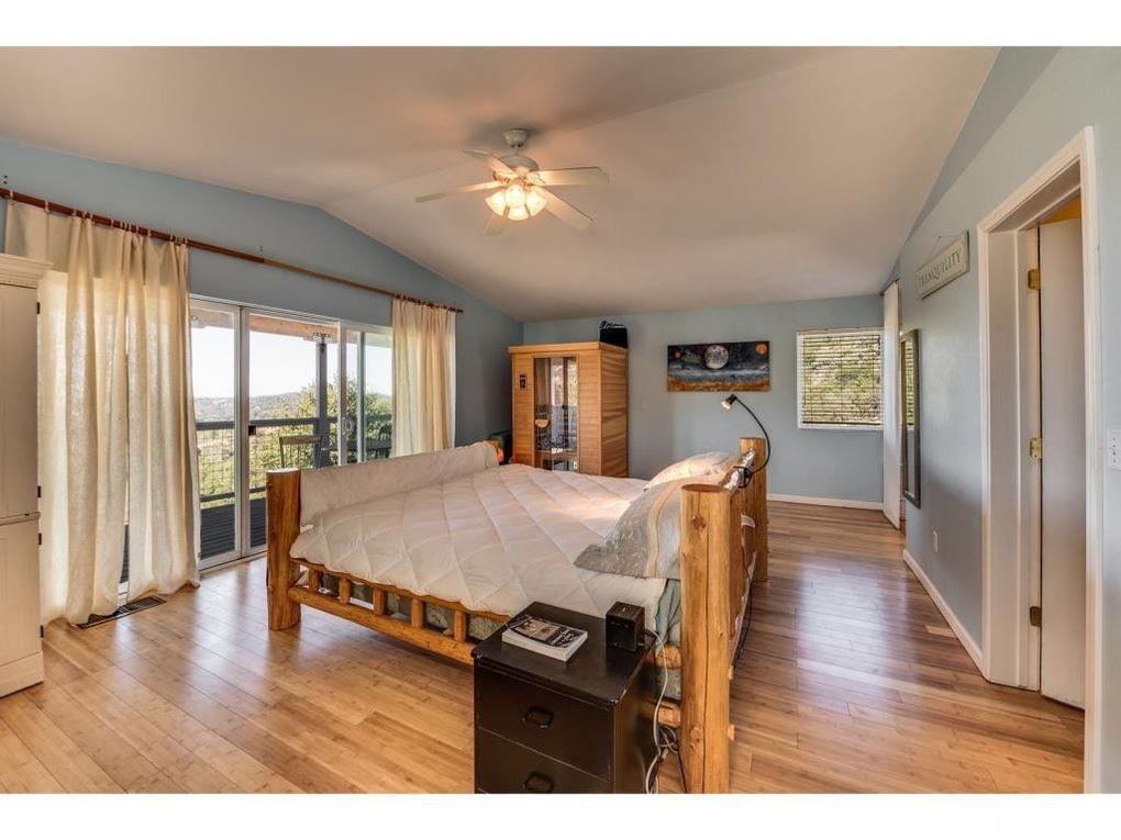 2235 Skunk Ranch Road Murphys, CA 95247 - Photo 10 of 22 a living room with furniture a large window and wooden floor