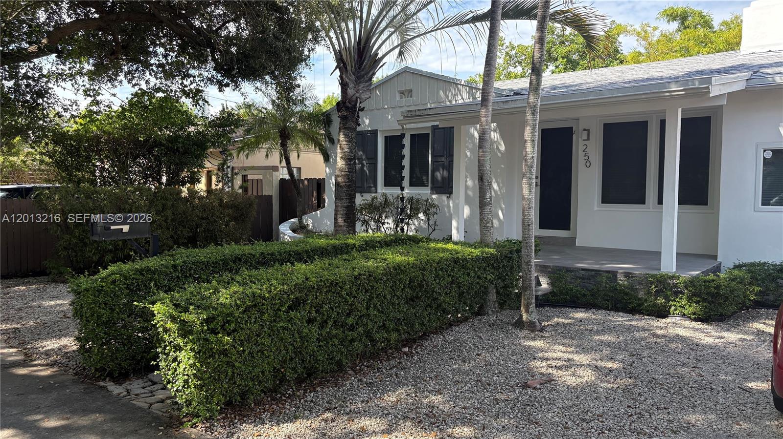250 Southwest 19th Road Miami, FL 33129 - Photo 2 of 22 a front view of a house with garden