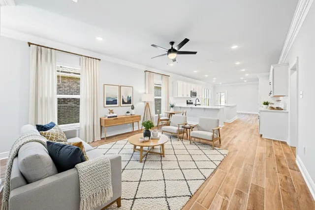 a big room with wooden floor and windows