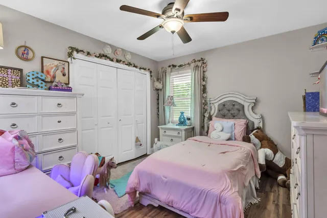 a bed room with furniture and a flat screen tv