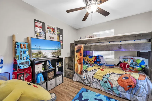 a view of a livingroom with workspace and a window