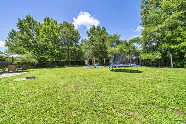a view of a swimming pool with a lounge chair