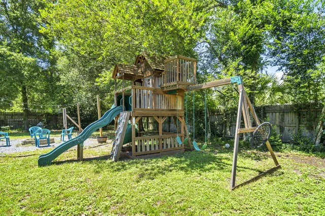 a view of a house with backyard porch and sitting area