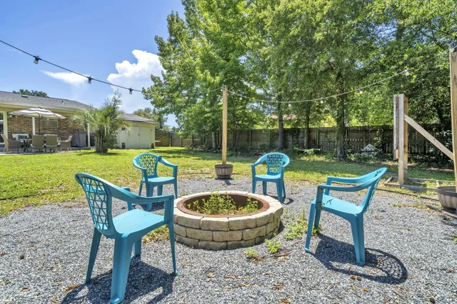 a view of a backyard of the house