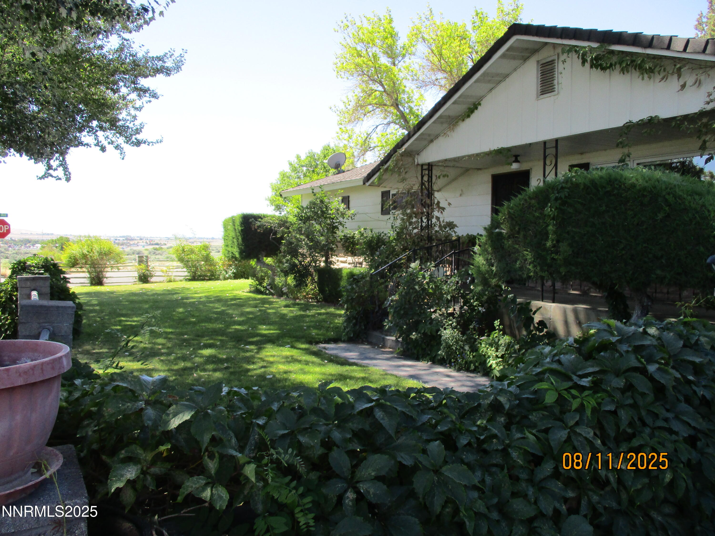 210 Modoc Drive Winnemucca, NV 89445 - Photo 13 of 25 a backyard of a house with plants and outdoor seating