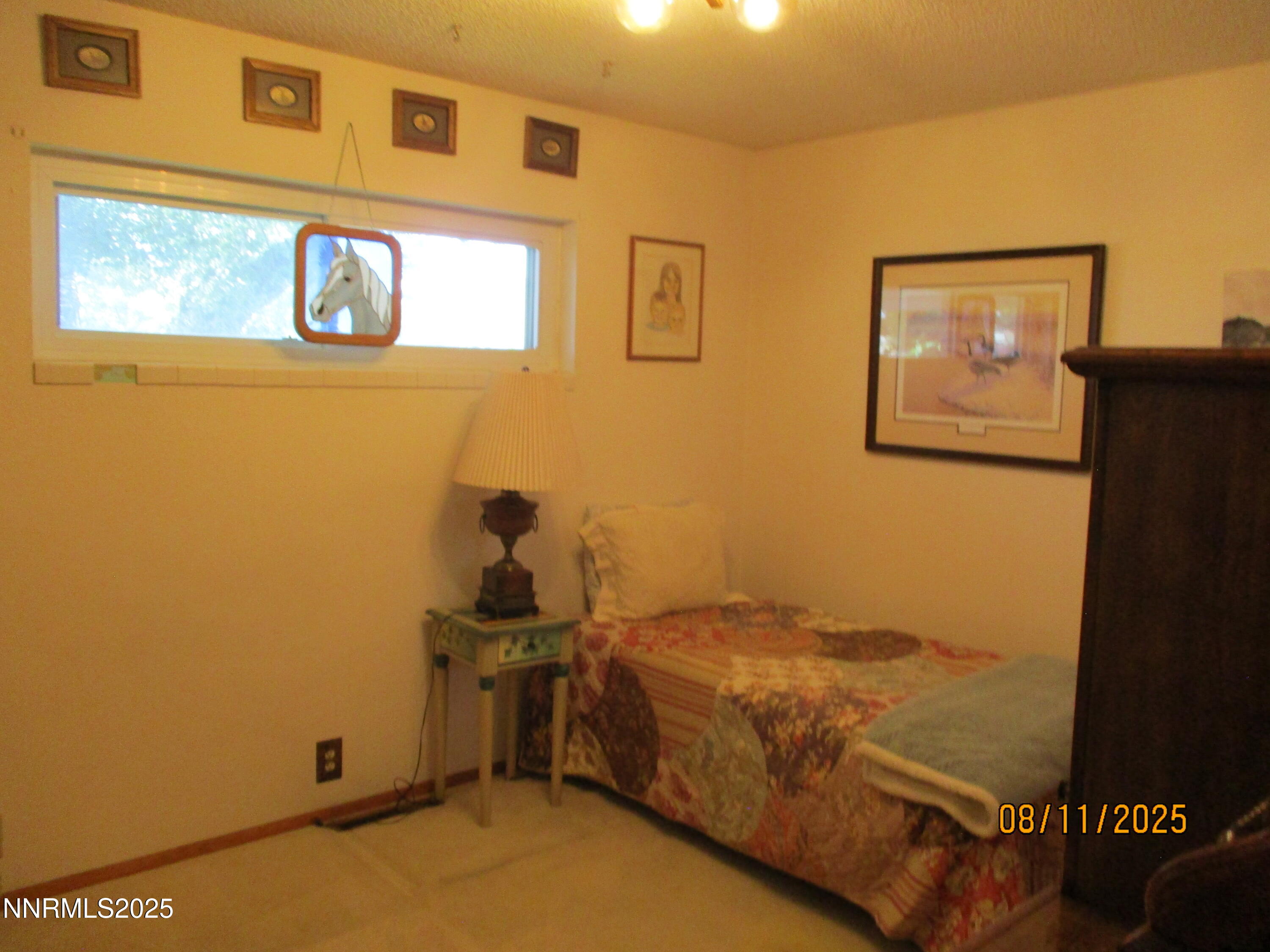210 Modoc Drive Winnemucca, NV 89445 - Photo 14 of 25 a bedroom with a bed and a window