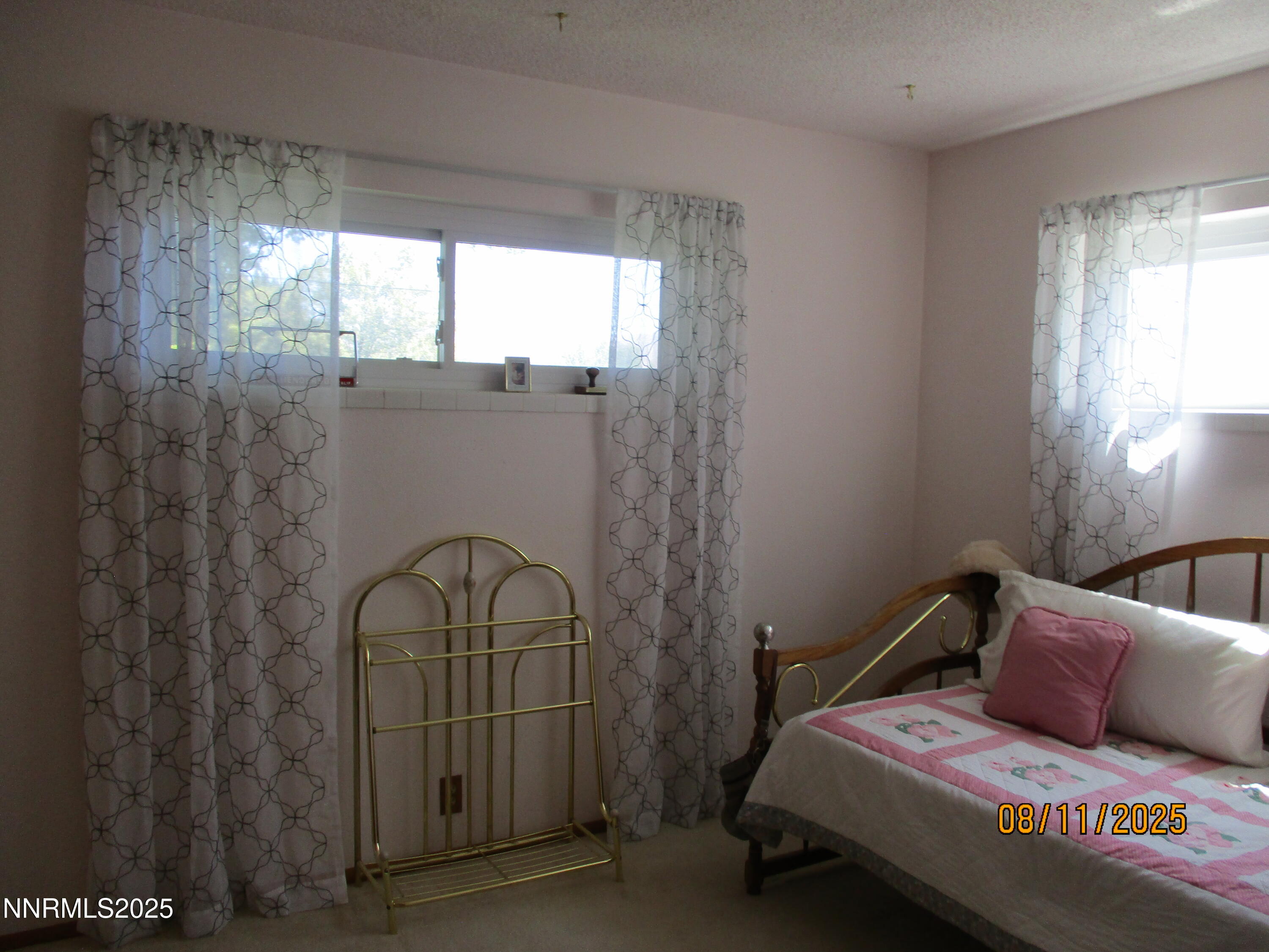 210 Modoc Drive Winnemucca, NV 89445 - Photo 18 of 25 a bedroom with a bed and window
