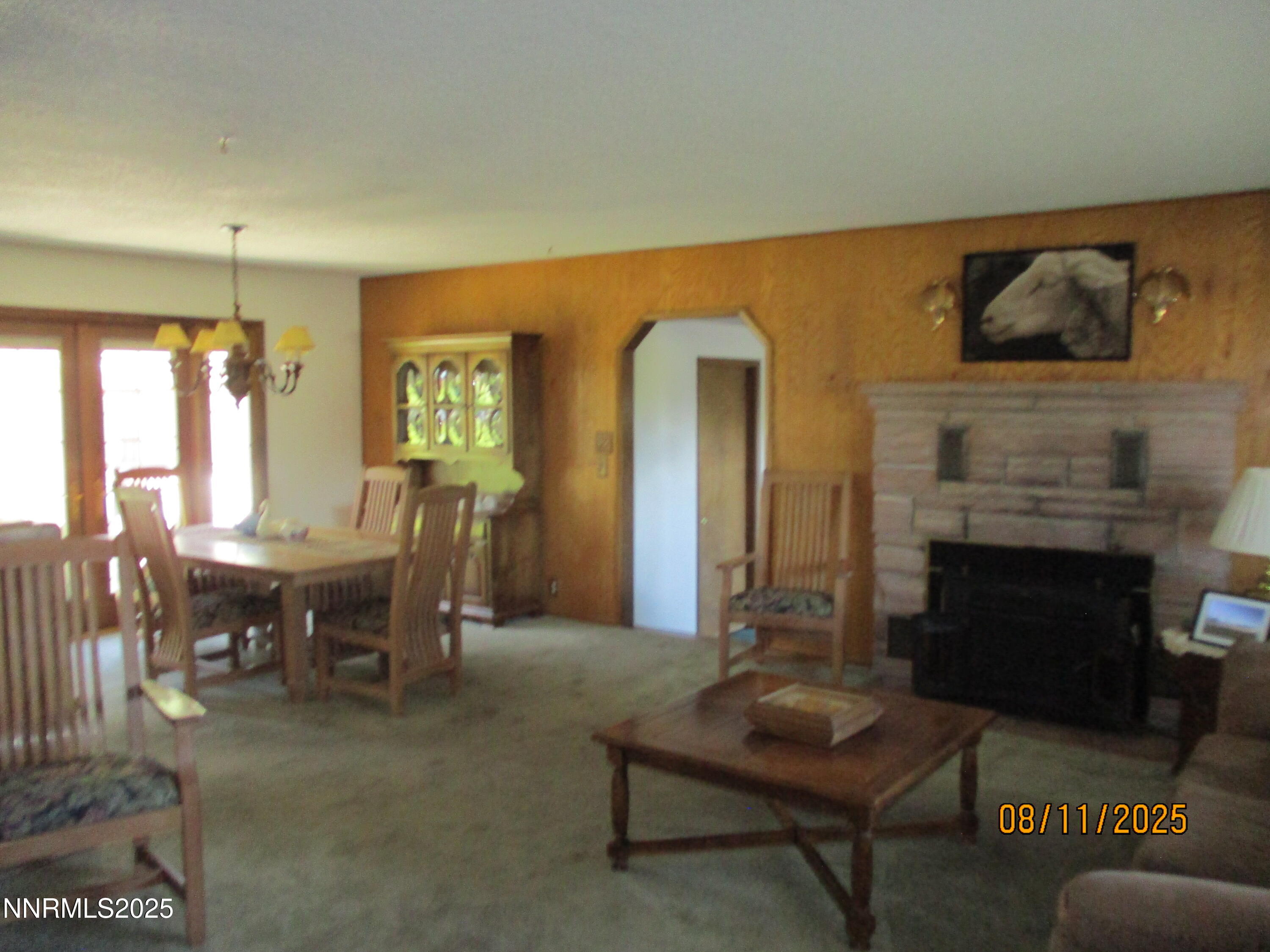 210 Modoc Drive Winnemucca, NV 89445 - Photo 22 of 25 a living room with furniture and a fireplace