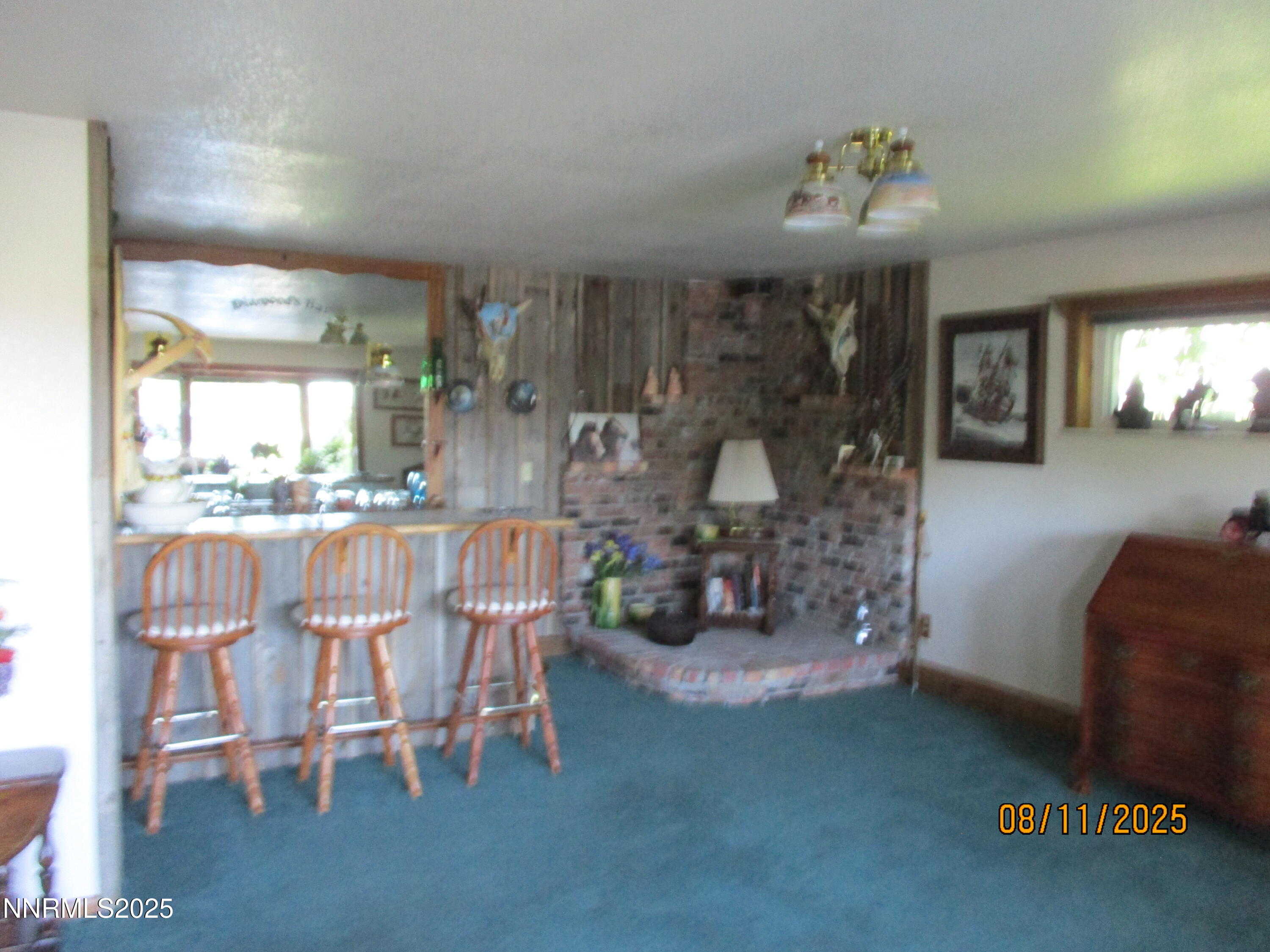 210 Modoc Drive Winnemucca, NV 89445 - Photo 24 of 25 a dining room with furniture and chandelier