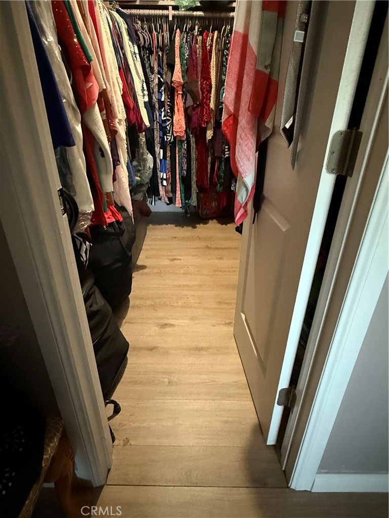 995 Pomona Road, Unit 41 Corona, CA 92882 - Photo 3 of 12 a view of walk in closet with clothes