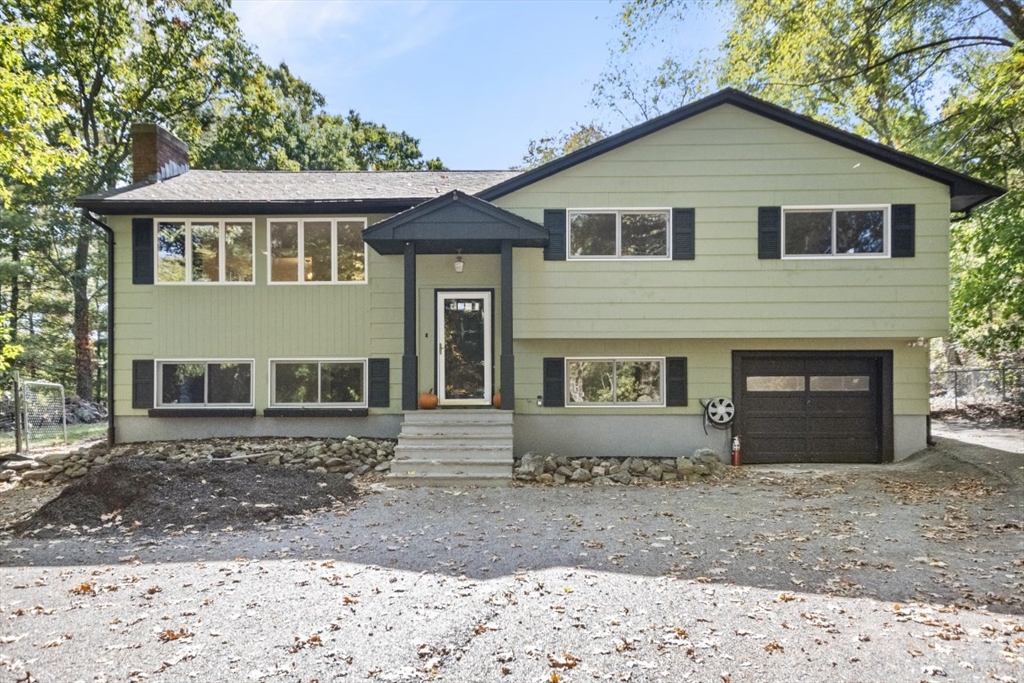 1704 Trapelo Road Waltham, MA 02451 - Photo 1 of 16 a front view of a house with a yard and a garden