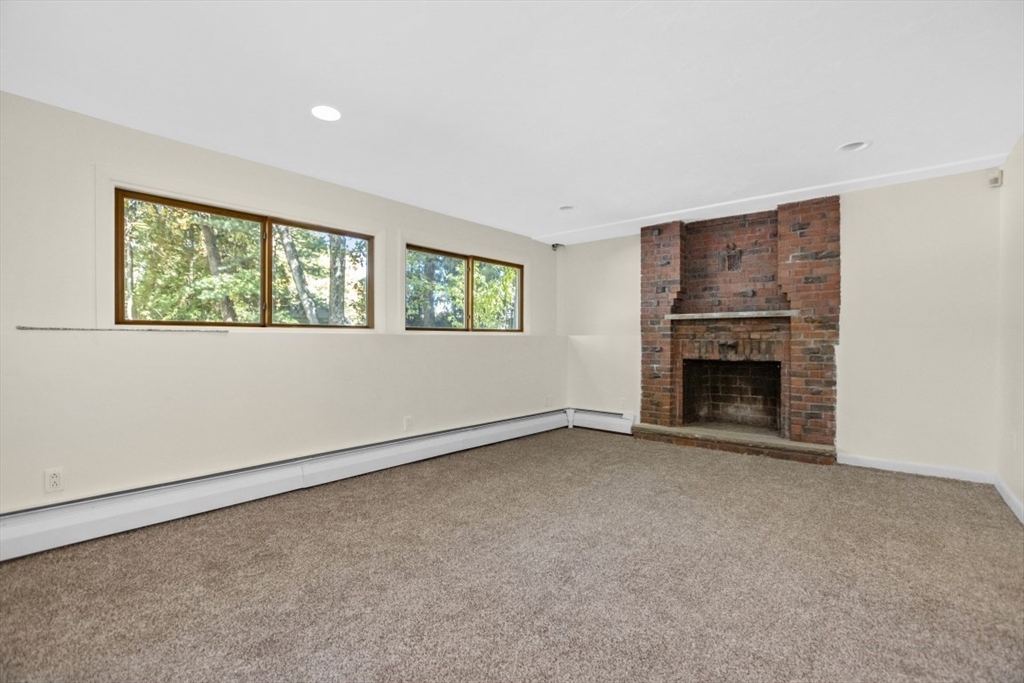 1704 Trapelo Road Waltham, MA 02451 - Photo 11 of 16 an empty room with windows