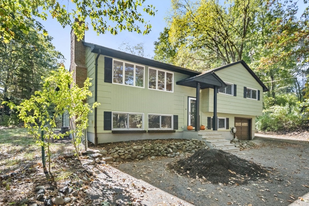1704 Trapelo Road Waltham, MA 02451 - Photo 2 of 16 a front view of a house with garden