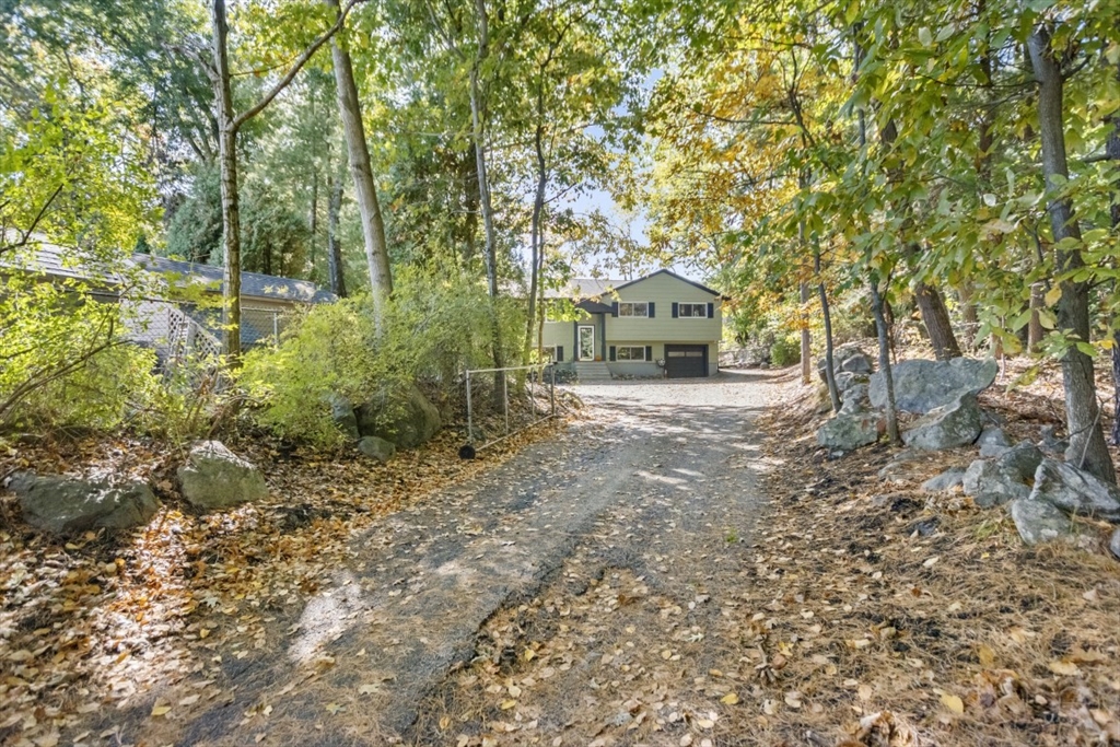 1704 Trapelo Road Waltham, MA 02451 - Photo 3 of 16 a front view of a house with a yard