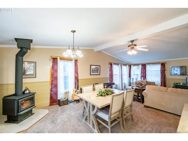 a dining room with furniture and window