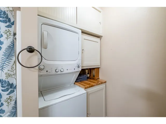 a bathroom with a toilet and a mirror