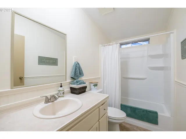 a living room with furniture a piano and a window