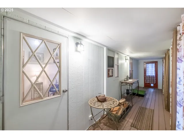 a view of a bedroom with a bed and furniture
