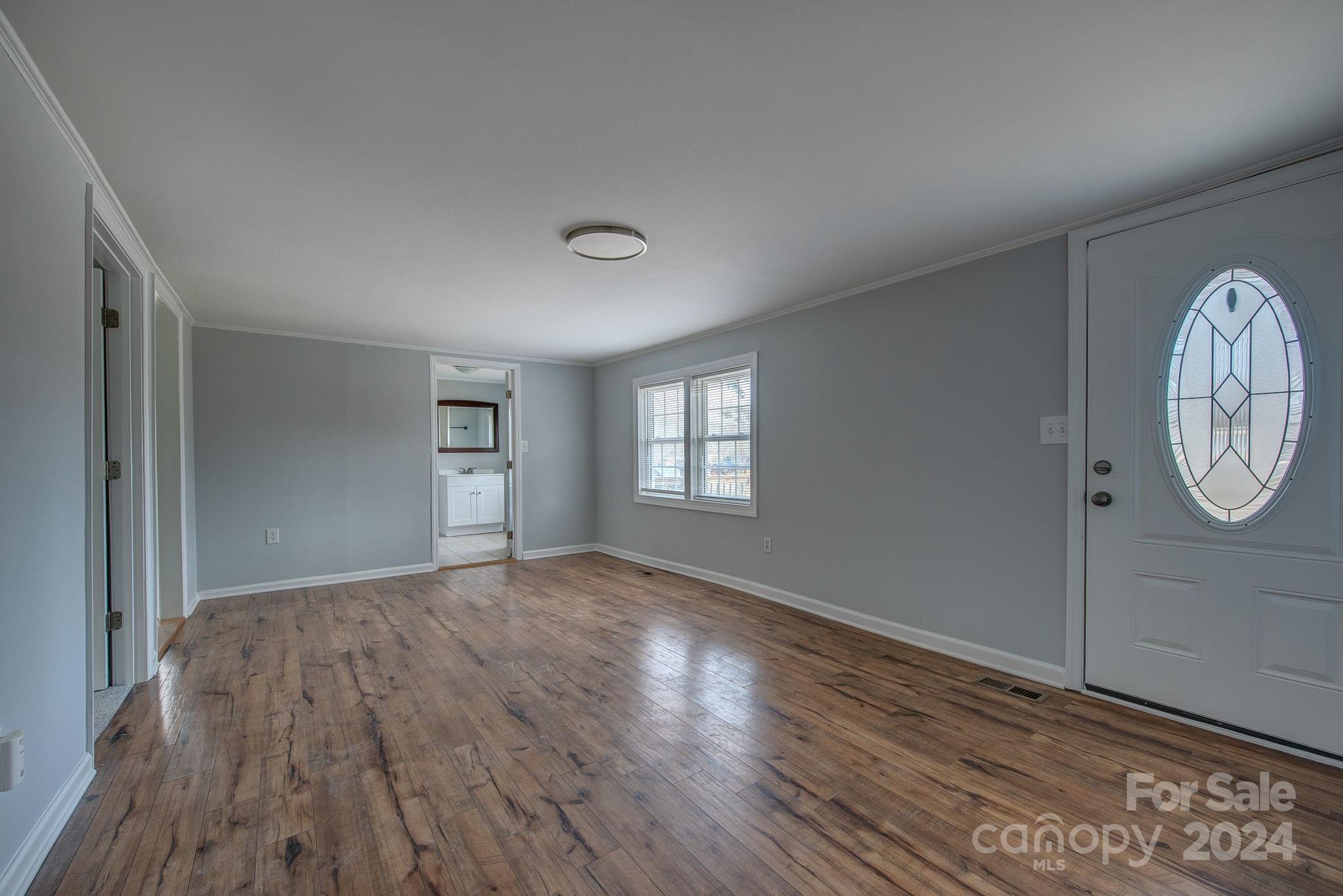 2714 Rufus Ratchford Road Gastonia, NC 28056 - Photo 13 of 28 a view of empty room with wooden floor