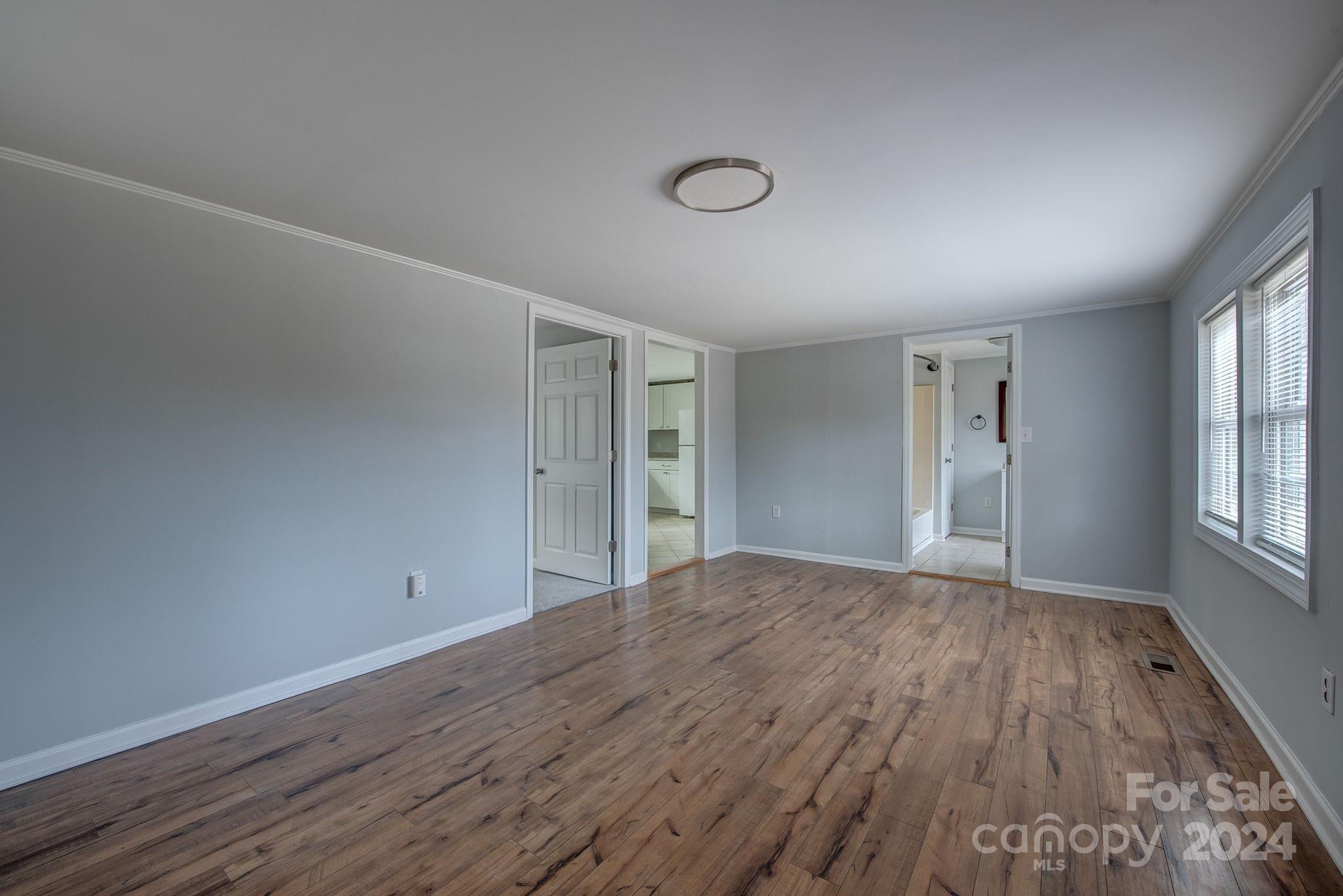 2714 Rufus Ratchford Road Gastonia, NC 28056 - Photo 14 of 28 a view of an empty room with wooden floor and a window